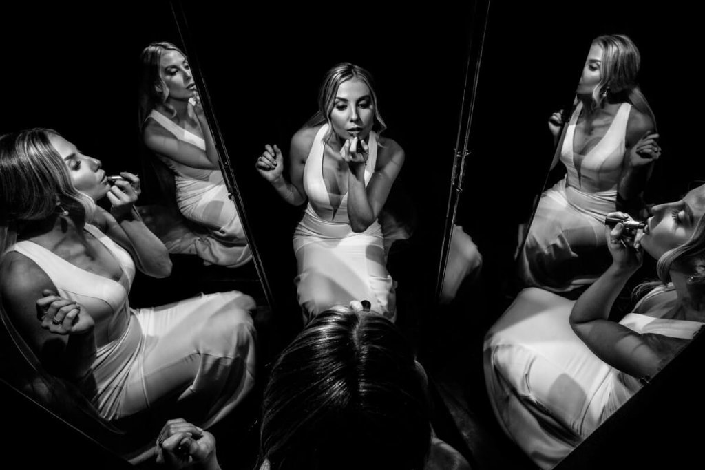 Sunni & Felipe Valdosta GA Wedding Photographers Bride in front of the mirror
