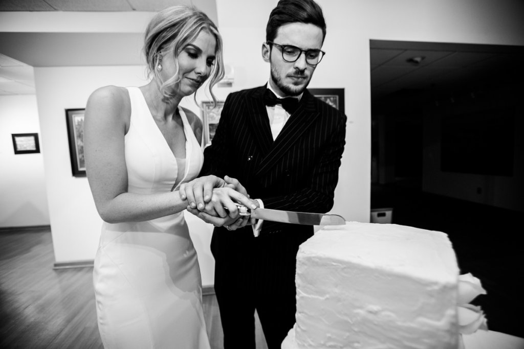 Bride and groom cutting the cake