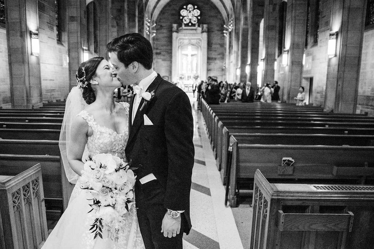 bride and groom wedding exit kiss