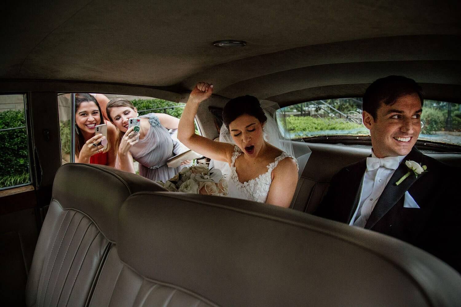 bride and groom in the car