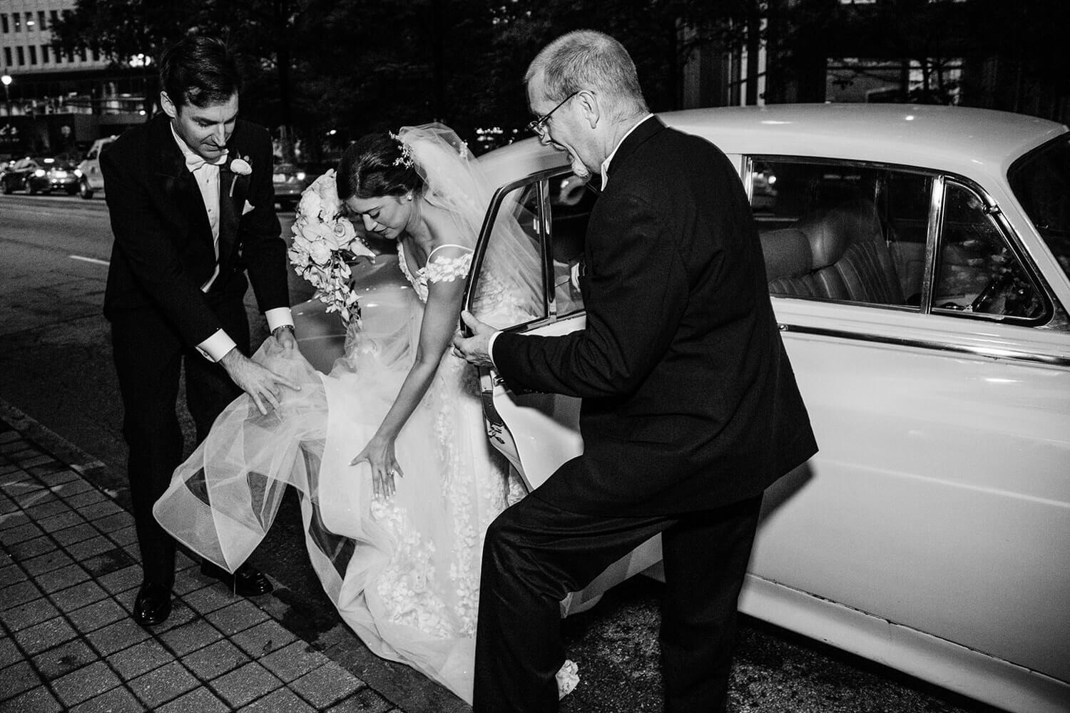 bride getting out of the wedding car