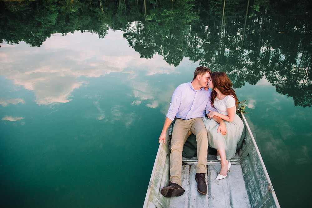 Christy & Connor couple at the boat kissing