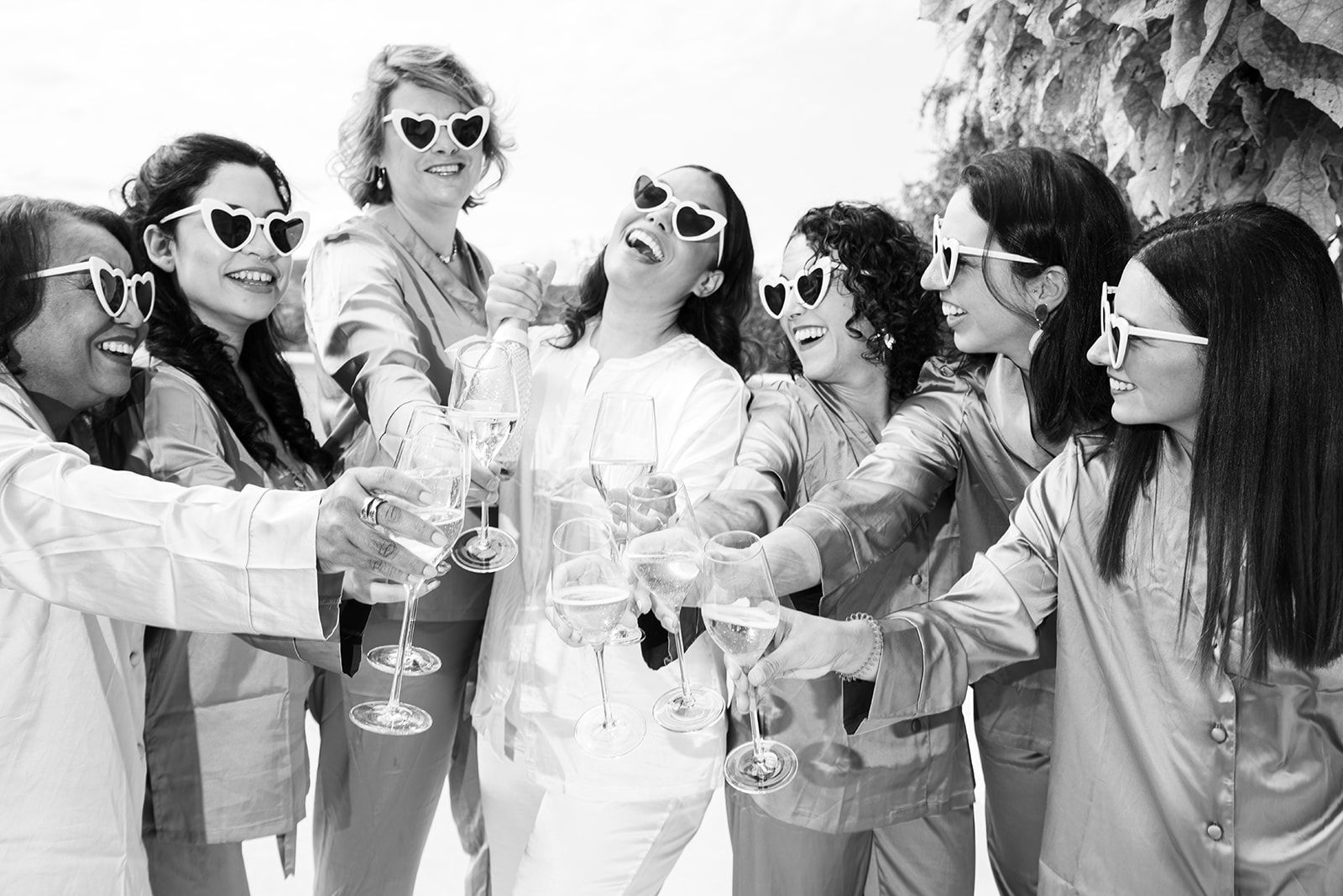 Bride celebrating in pajamas and champagne at a vineyard in Austria