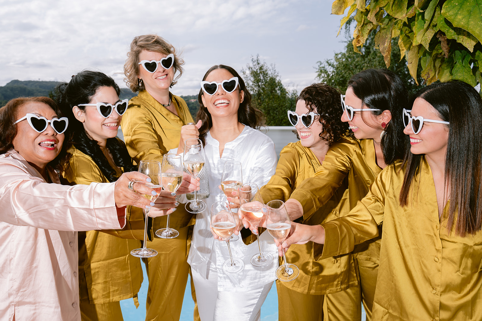 Bride celebrating in pajamas and champagne at a vineyard in Austria
