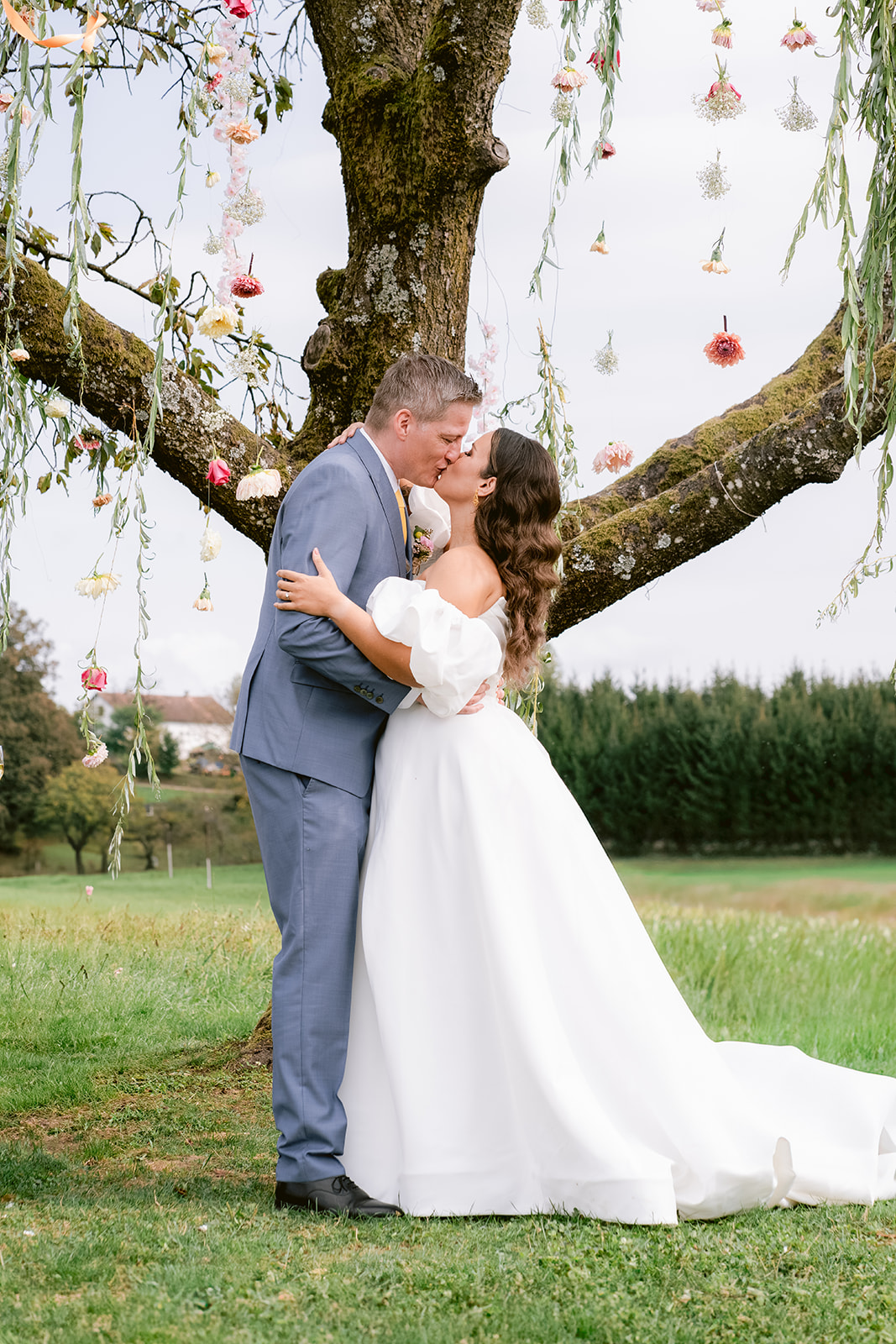 Outdoor vineyard wedding ceremony under tree at Weingut Holler, Austria