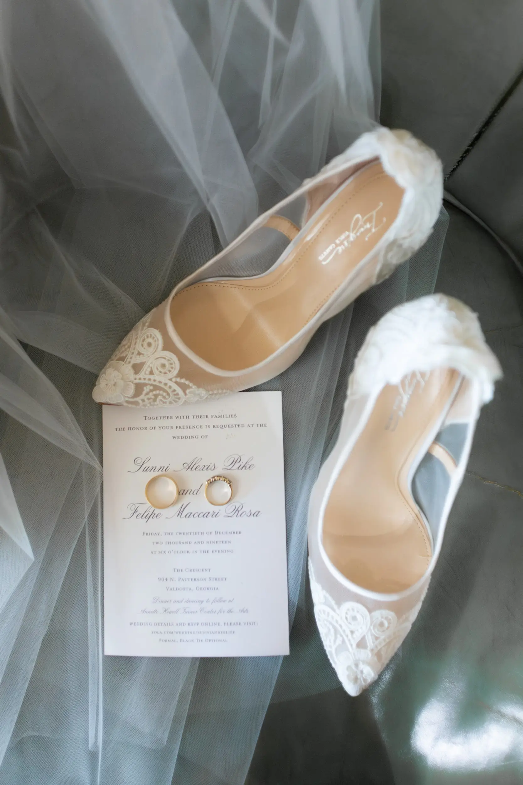 details composition with shoes, rings and veil