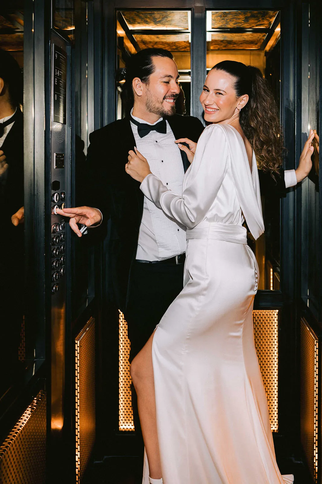 Bride and groom portrait at the elevator VELAS wedding photographers