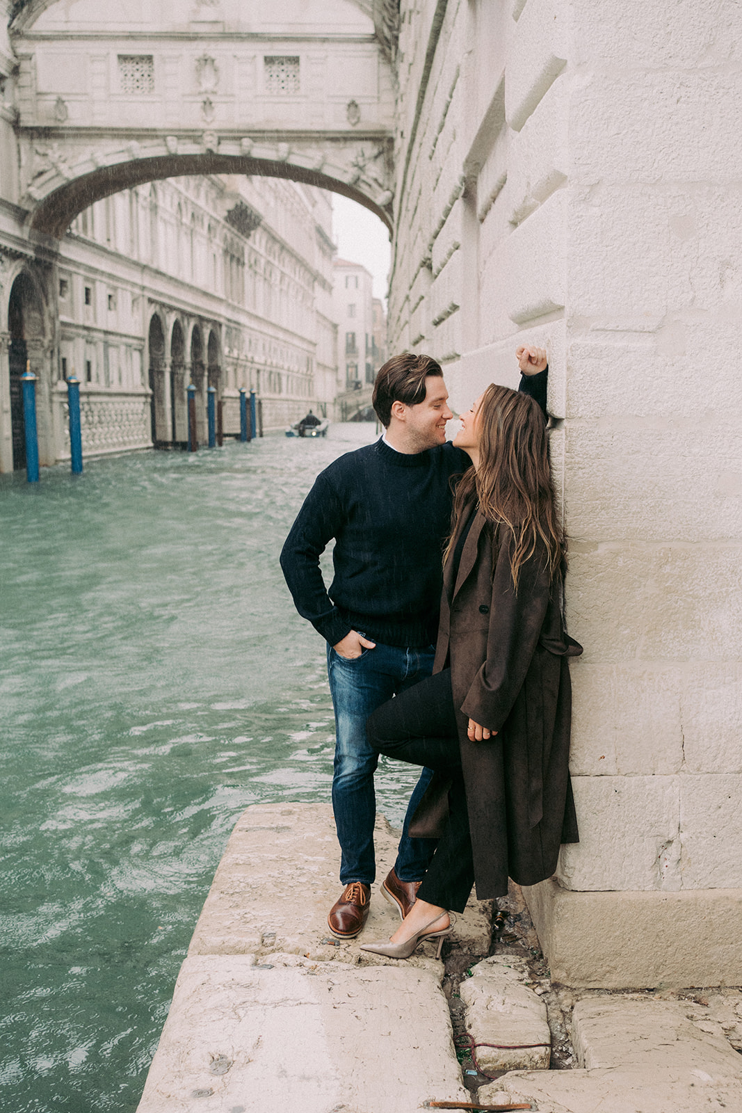 Engagement photos near Venice canals with cinematic mood